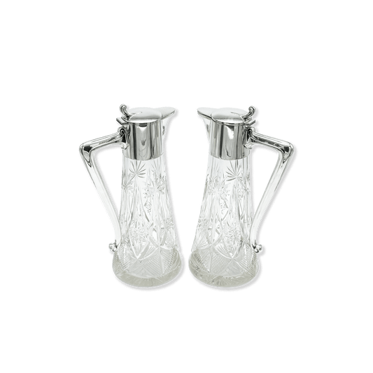 Pair of Art Nouveau Glass Pitchers with Silver Accents