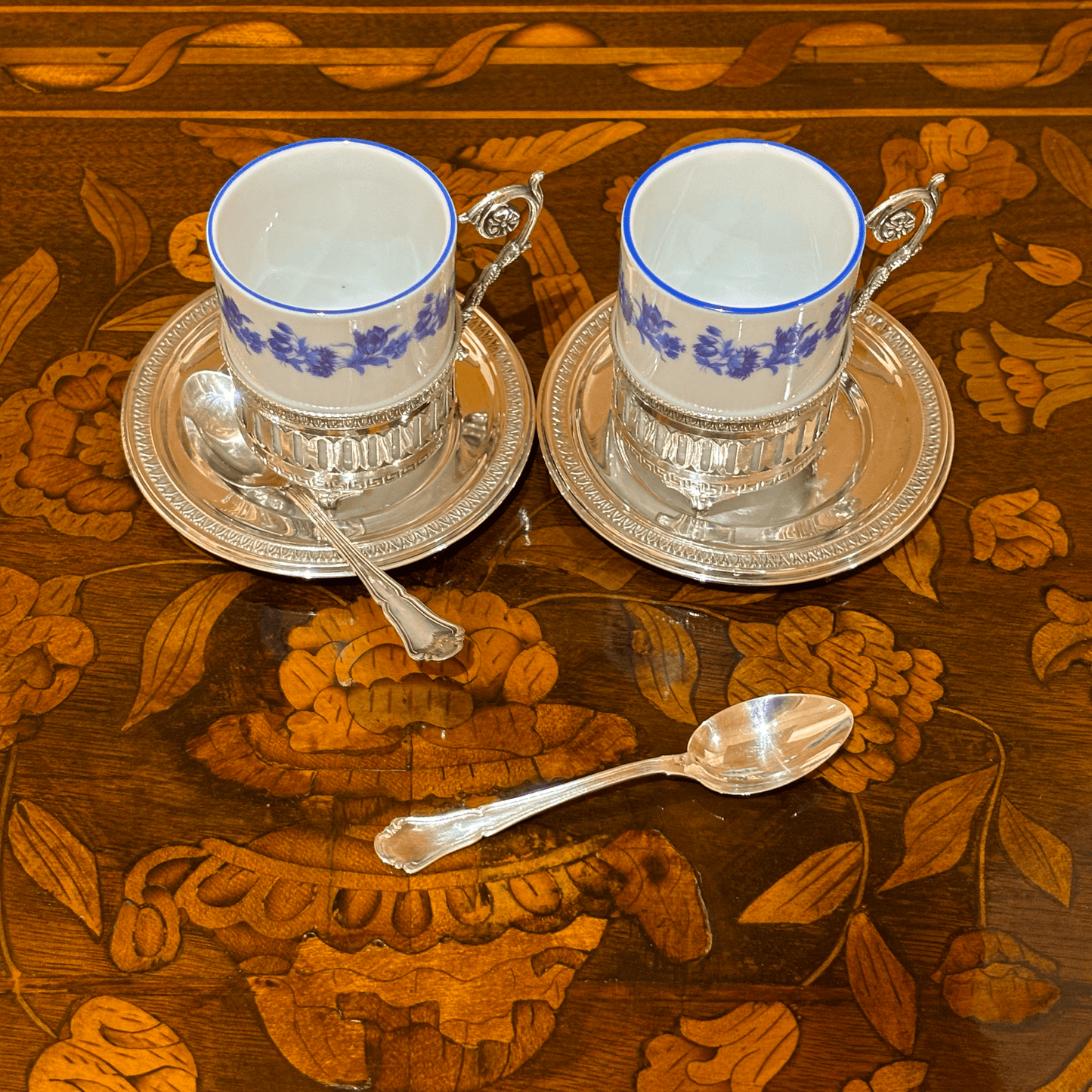 Pair of Porcelain Coffee Cups with Silver Saucers