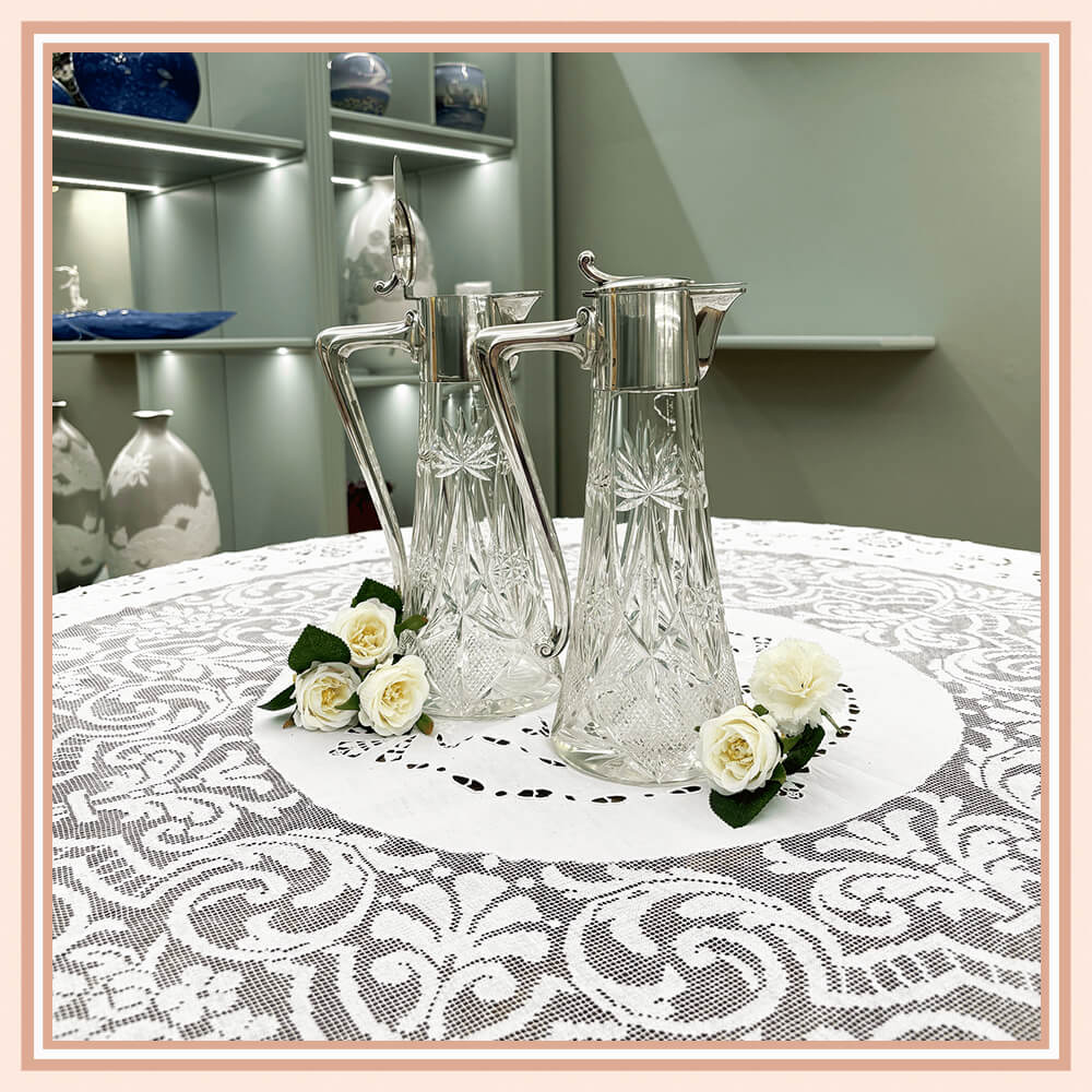 Pair of Art Nouveau Glass Pitchers with Silver Accents
